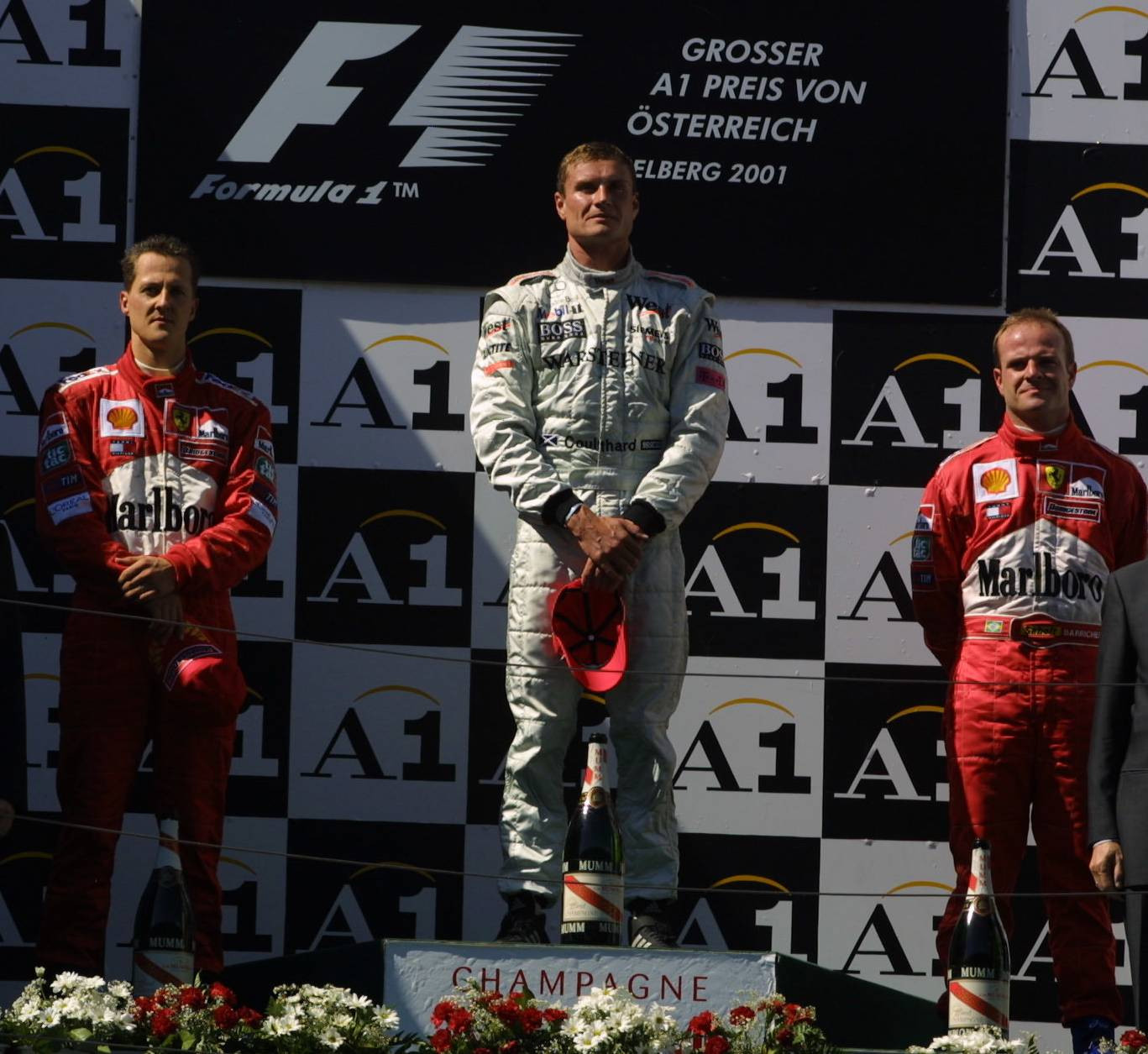 Подіум Гран-прі Австрії 2001: Міхаель Шумахер (2 місце), Девід Култхард (1 місце) і Рубенс Баррікелло (3 місце)