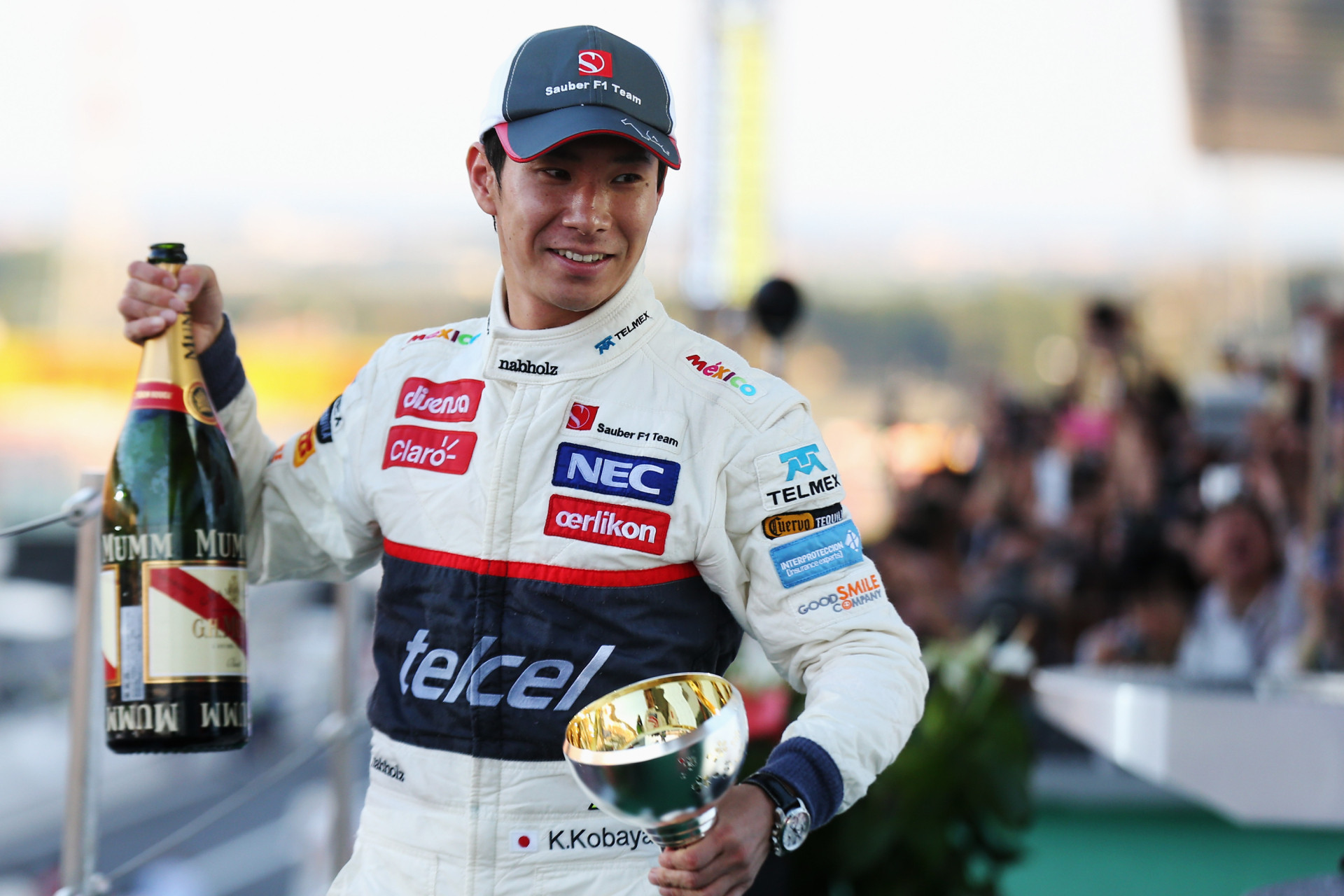 Камуї Кобаясі на подіумі Гран-прі Японії 2012