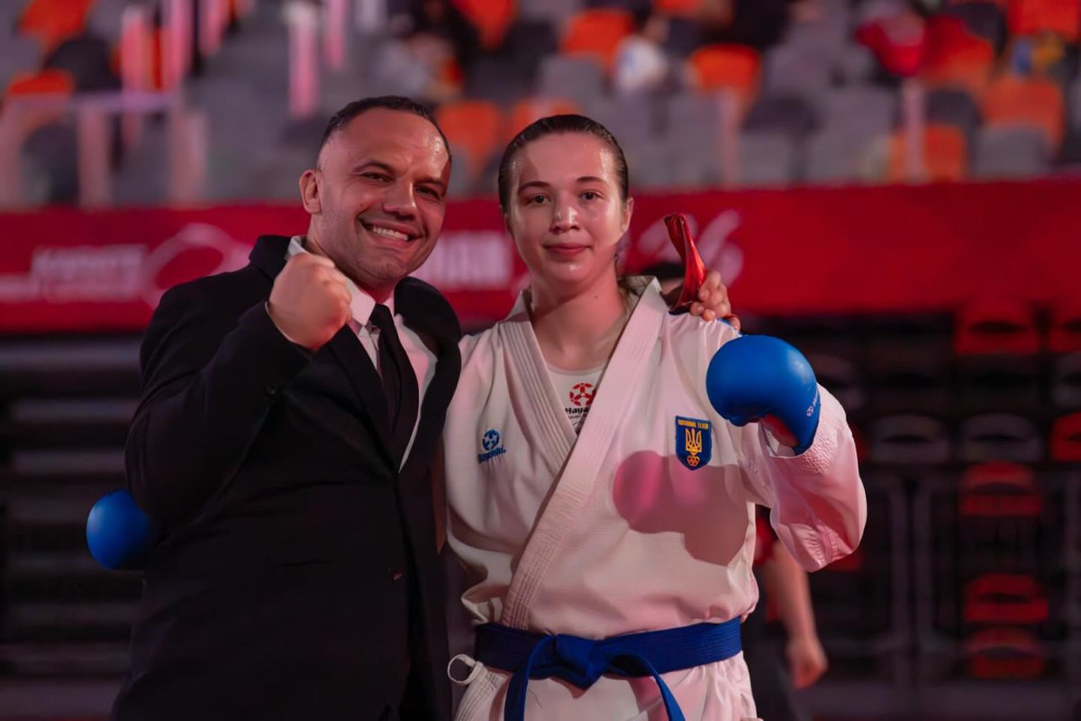 Дарія Булай із тренером Олександром Пікуліним