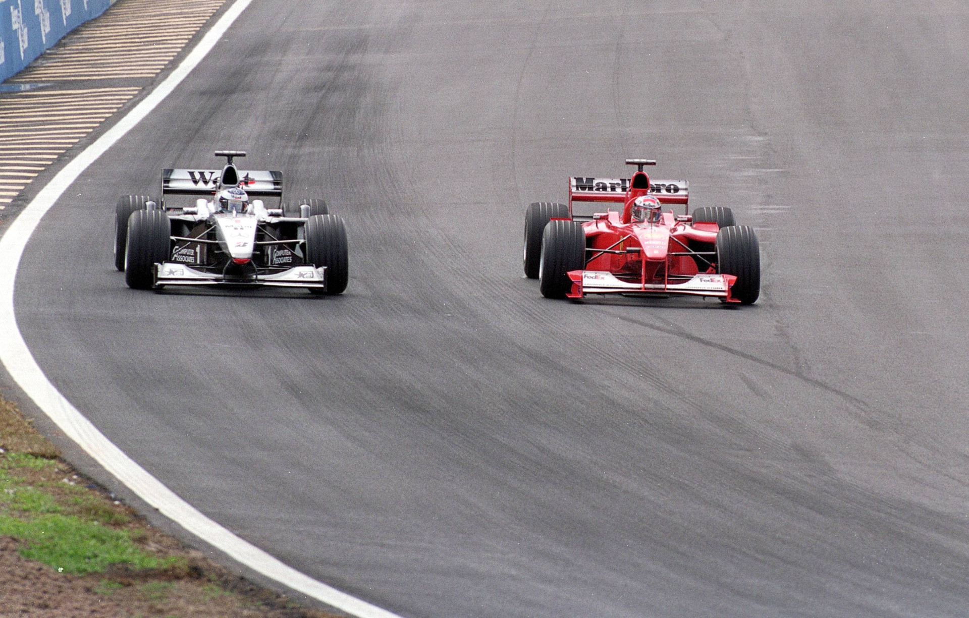 Michael Schumacher overtakes Mika hakkinen at Brazil's Grand Prix 2000