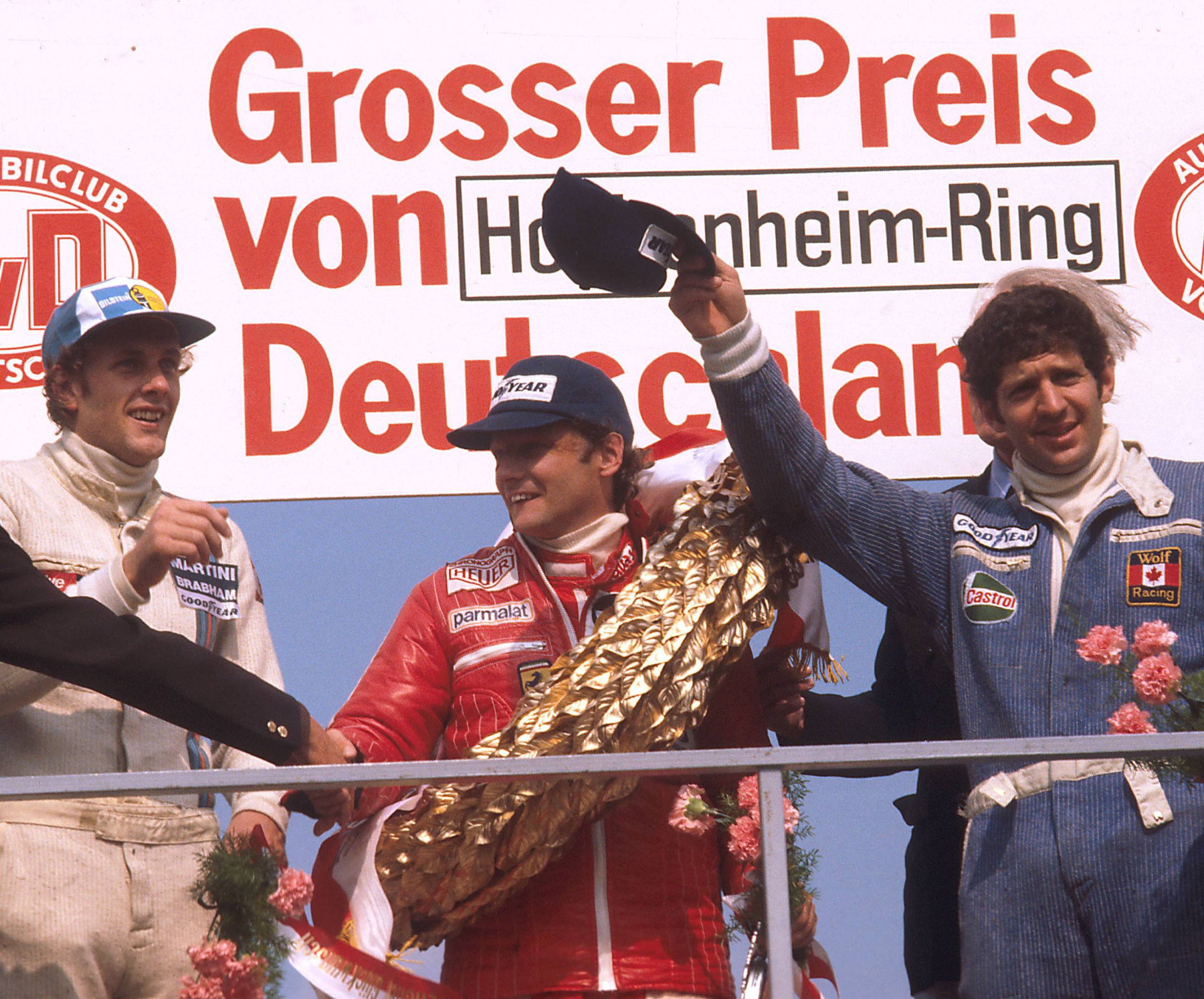 Ханс-Йоахим Штук (3 место), Ники Лауда (1 место) и Джоди Шектер (2 место) после Гран-при Германии 1977