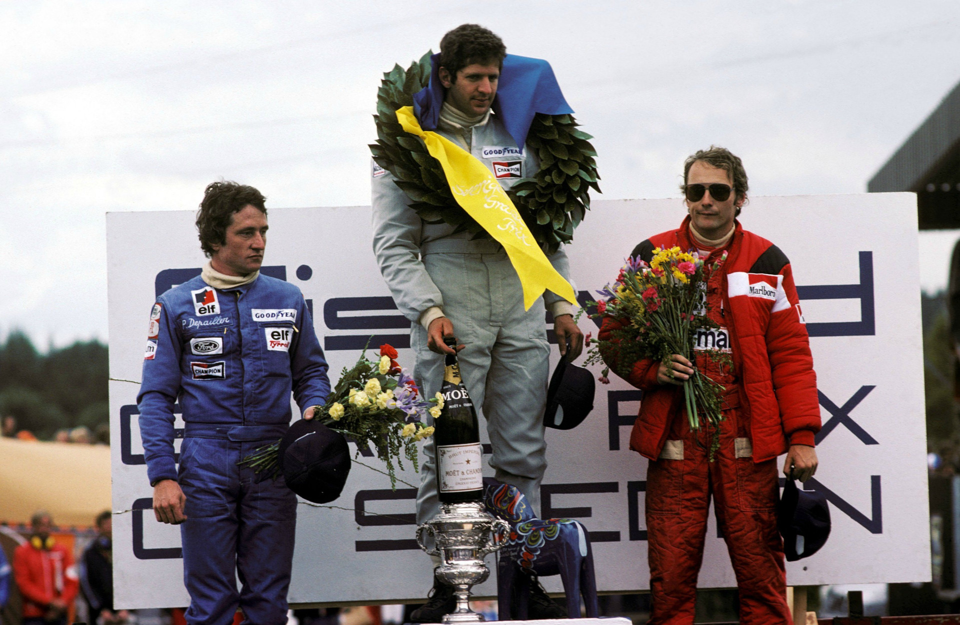 Podium Grand Prix of Sweden 1976: Patrick Depayier (2nd place), Jodi Shekter (1st place) and Niki Lauda (3rd place)