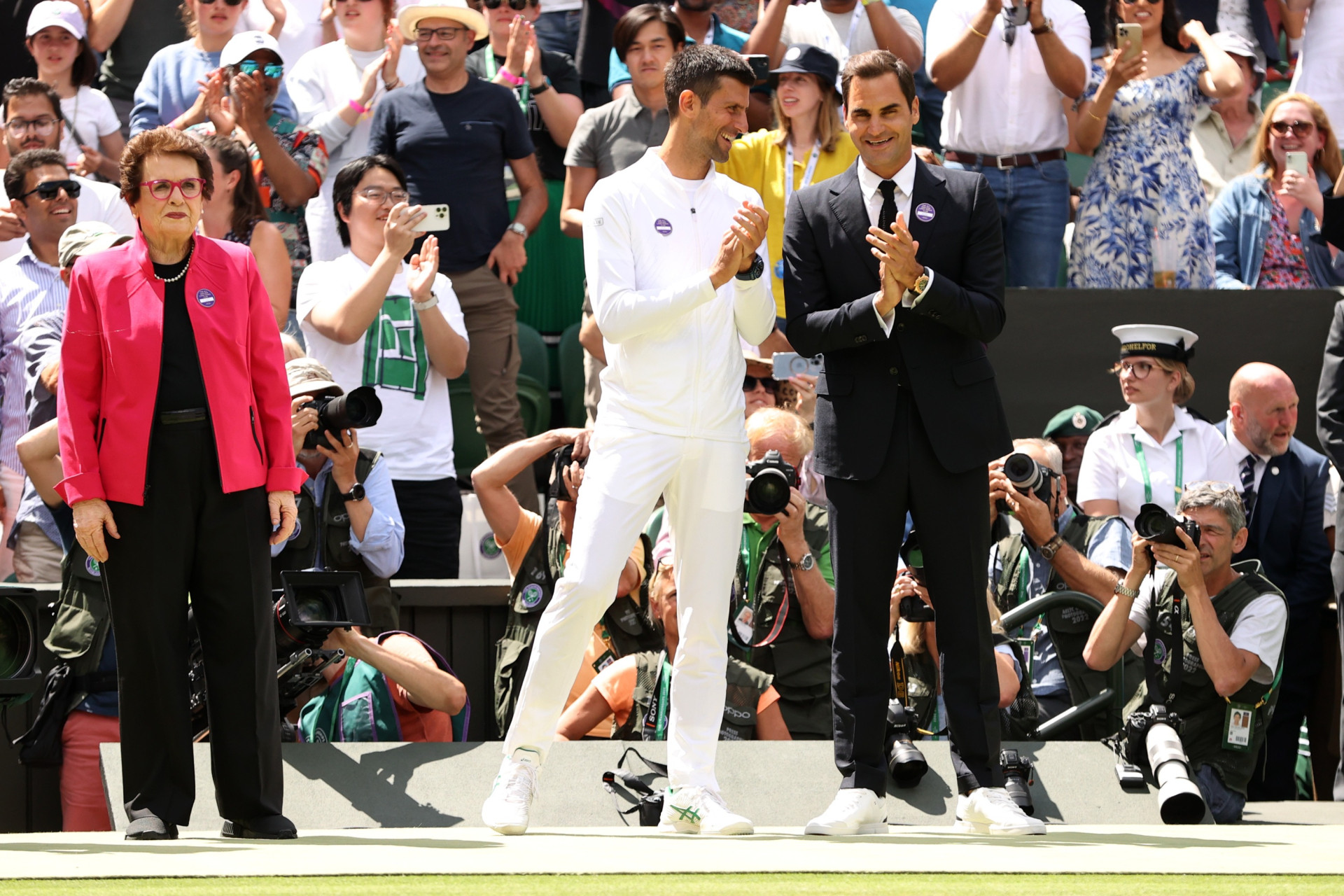 Billy Gin King (left), Novak Dzhokovich (in the center) and Roger Feder during the celebration of the 100th Anniversary of the Central Court at Wimbledon-2022